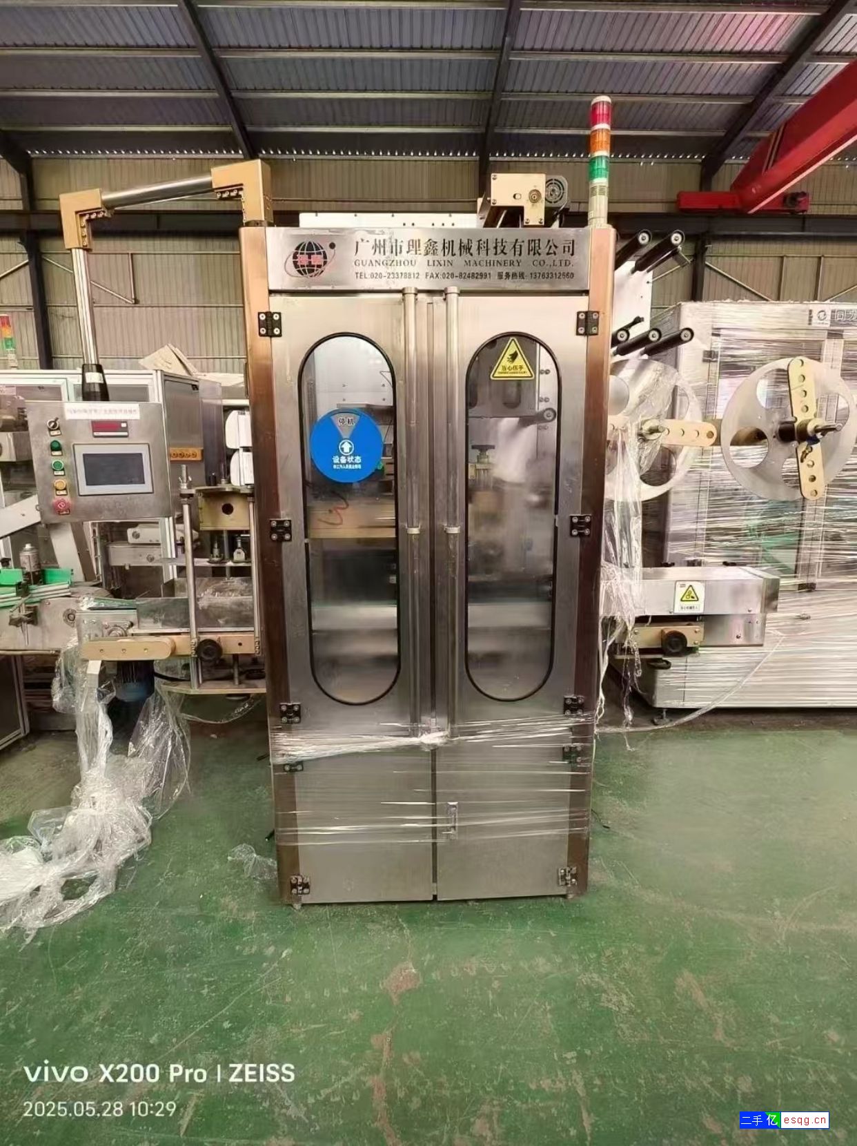 转让9成新广州理鑫套标机，饮料矿泉水套标机-1